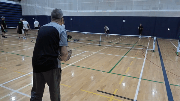 Bad example of how to get to the net in pickleball